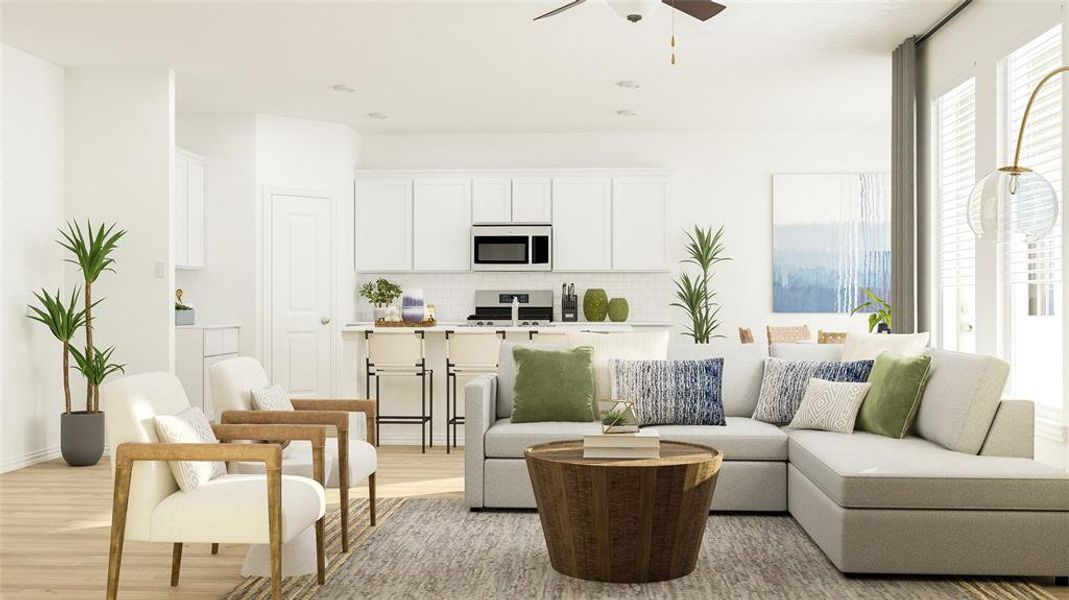 Living room with light hardwood / wood-style floors and ceiling fan