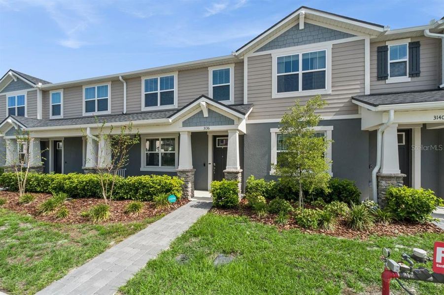 Front exterior of a new home in , Apopka, FL, highlighting curb appeal (Image 26). Front exterior of a new home in , Apopka, FL, highlighting curb appeal (Image 26).