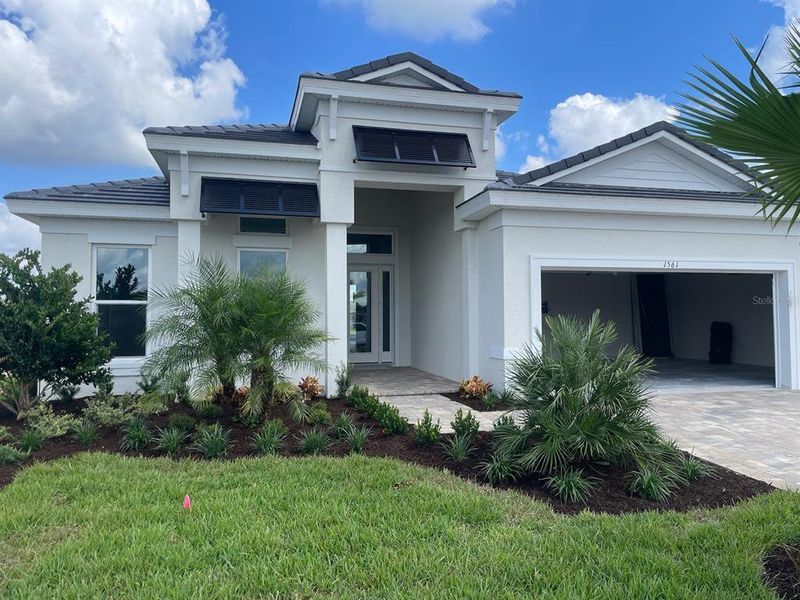 Front exterior of a new home in , Deland, FL, highlighting curb appeal (Image 1). Front exterior of a new home in , Deland, FL, highlighting curb appeal (Image 1).