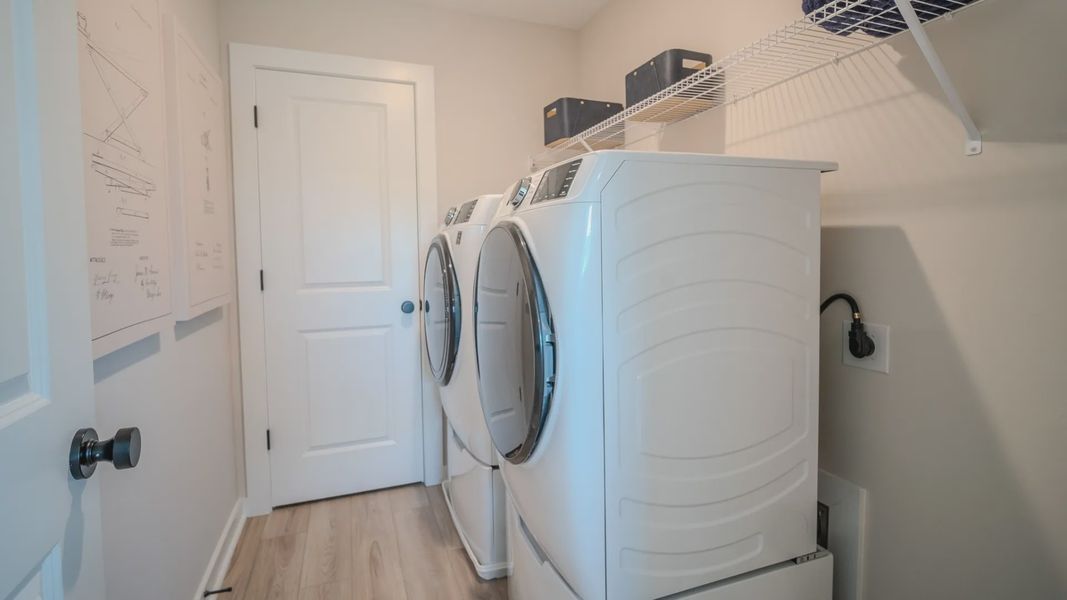 Dedicated laundry space with ventilated shelf