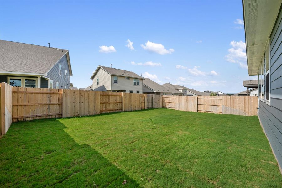 Exterior details and patio area of a home in Cannon Ranch, Dripping Springs (Image 17).
