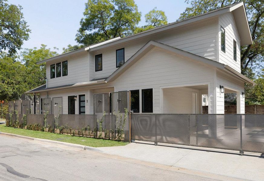 View of front of home featuring a fenced front yard View of front of home featuring a fenced front yard