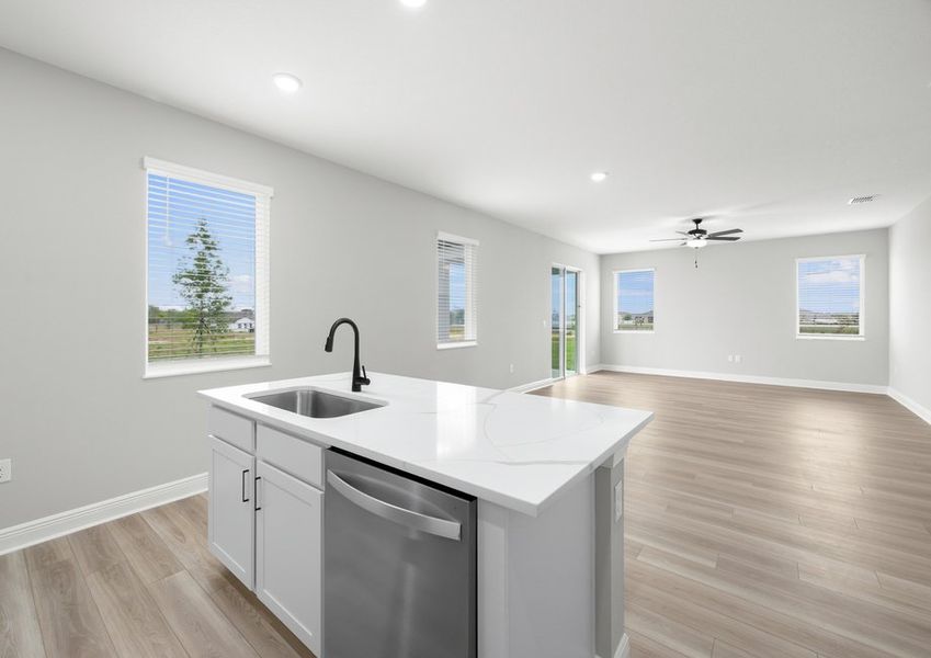 The kitchen overlooks the dining and family room, making this the hub of the home