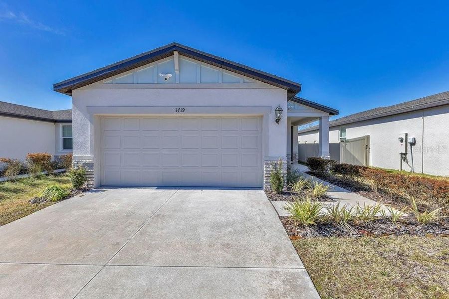 Front exterior of a new home in Park East, Plant City, FL, highlighting curb appeal (Image 22).