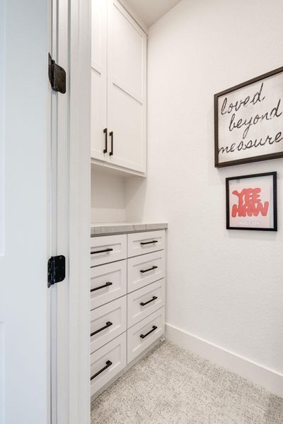 Detailed view of baseboards and carpet