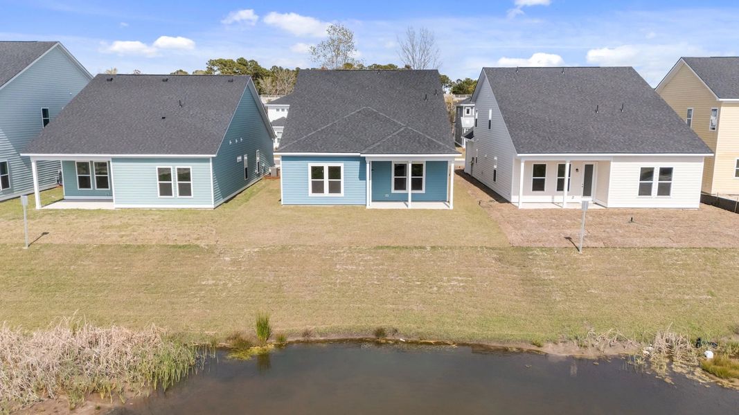 Exterior details and patio area of a home in Blue Heron Retreat, Little River (Image 16).