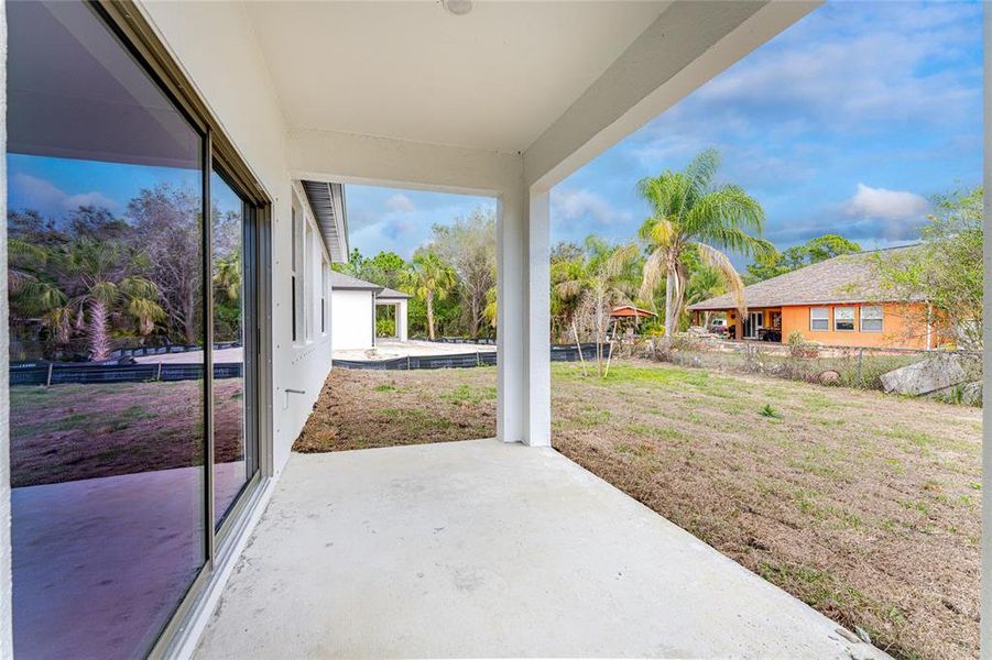 Exterior details and patio area of a home in , North Port (Image 24).