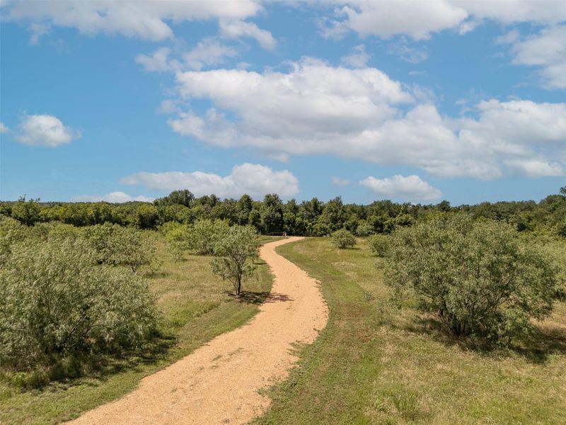 View of home's community with a wooded view