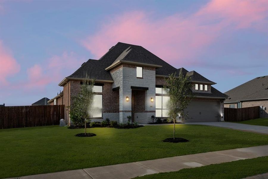 Front exterior of a new home in Coyote Crossing, Godley, TX, highlighting curb appeal (Image 27). Front exterior of a new home in Coyote Crossing, Godley, TX, highlighting curb appeal (Image 27).