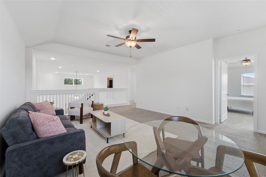 An inviting open-concept living area with a clear sightline to an adjacent room. An inviting open-concept living area with a clear sightline to an adjacent room.
