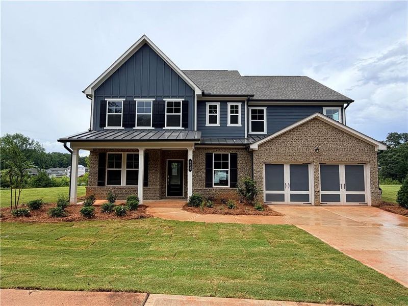 Front exterior of a new home in , Conyers, GA, highlighting curb appeal (Image 1). Front exterior of a new home in , Conyers, GA, highlighting curb appeal (Image 1).