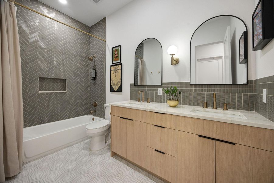 The builder did not skimp on design on this primary bathroom. The builder did not skimp on design on this primary bathroom.