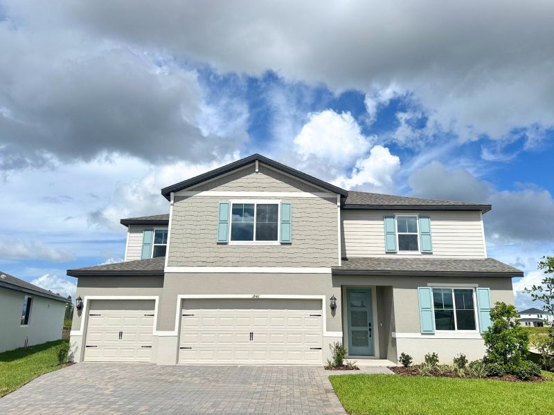 Front exterior of a new home in Two Rivers - Signature Series, Zephyrhills, FL, highlighting curb appeal (Image 1).