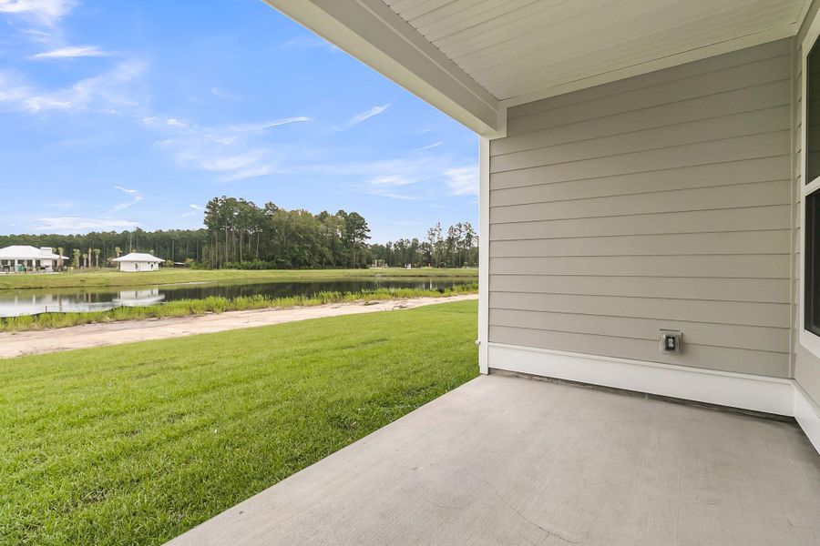 Front exterior of a new home in Tidewater at Lakes of Cane Bay, Summerville, SC, highlighting curb appeal (Image 1).