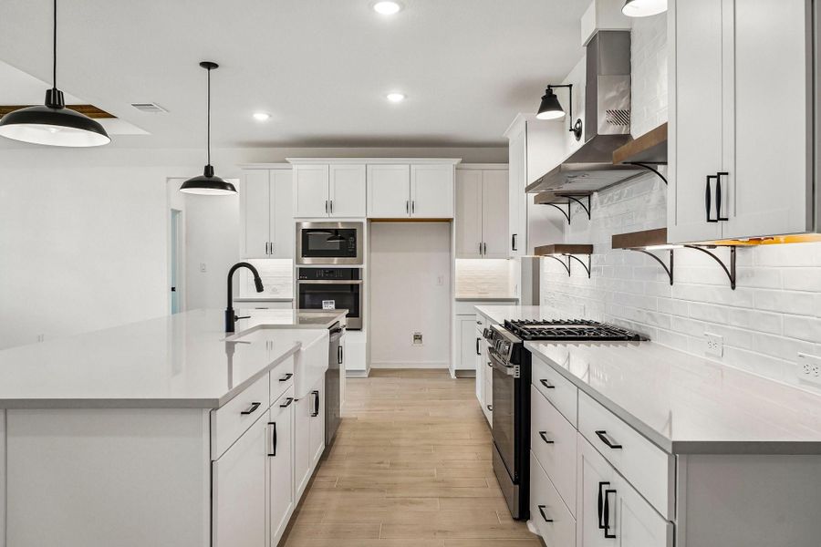 Stylish kitchen with quartz counters and floating shelves Stylish kitchen with quartz counters and floating shelves