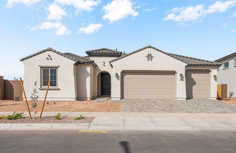 Front exterior of a new home in Artisan at Asante, Surprise, AZ, highlighting curb appeal (Image 21).