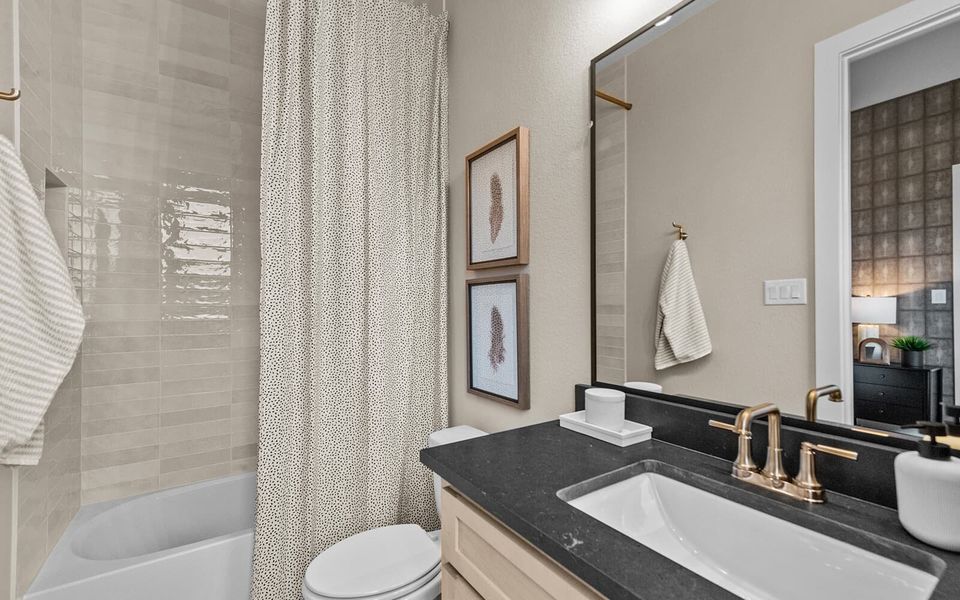 Furnished interior in a model home at 55' Traditional Homes at The Grove Frisco in Frisco (Image 19).