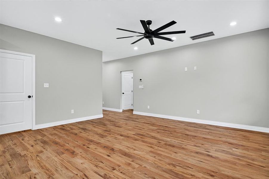 Empty room with light wood-style floors, recessed lighting, and ceiling fan Empty room with light wood-style floors, recessed lighting, and ceiling fan