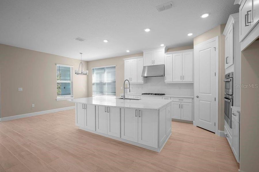 Furnished interior view inside a new home in Esplanade at Wiregrass Ranch, Wesley Chapel (Image 9).