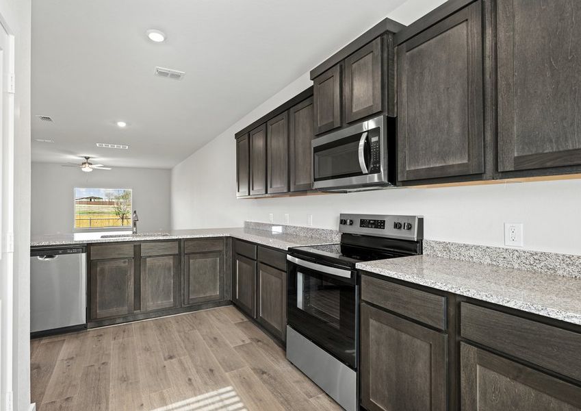 The kitchen has stainless-steel, energy-efficient appliances.