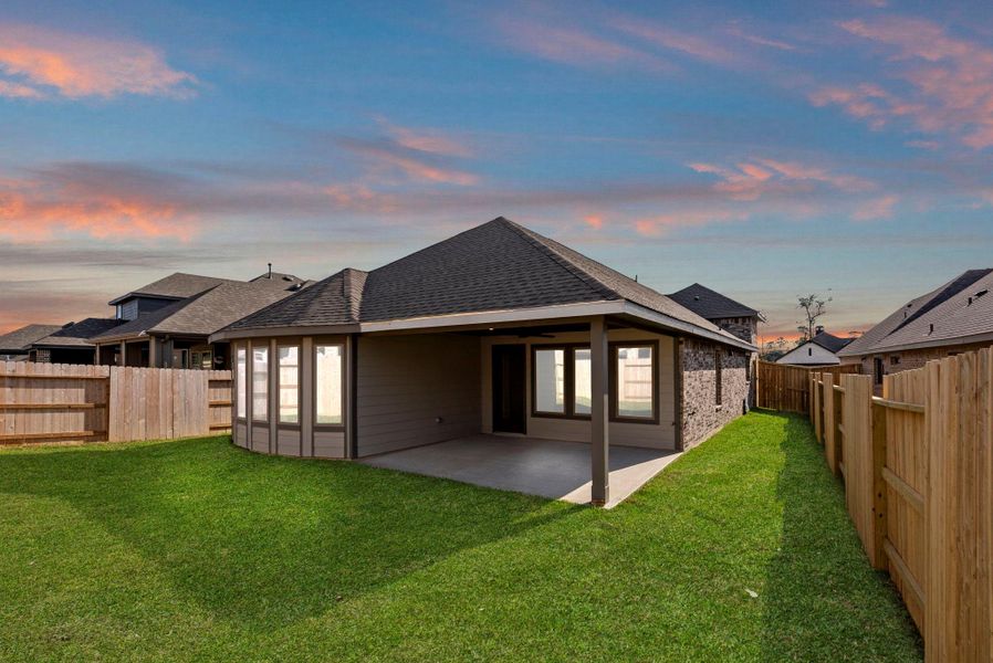 Exterior details and patio area of a home in Grand Central Park, Conroe (Image 3).