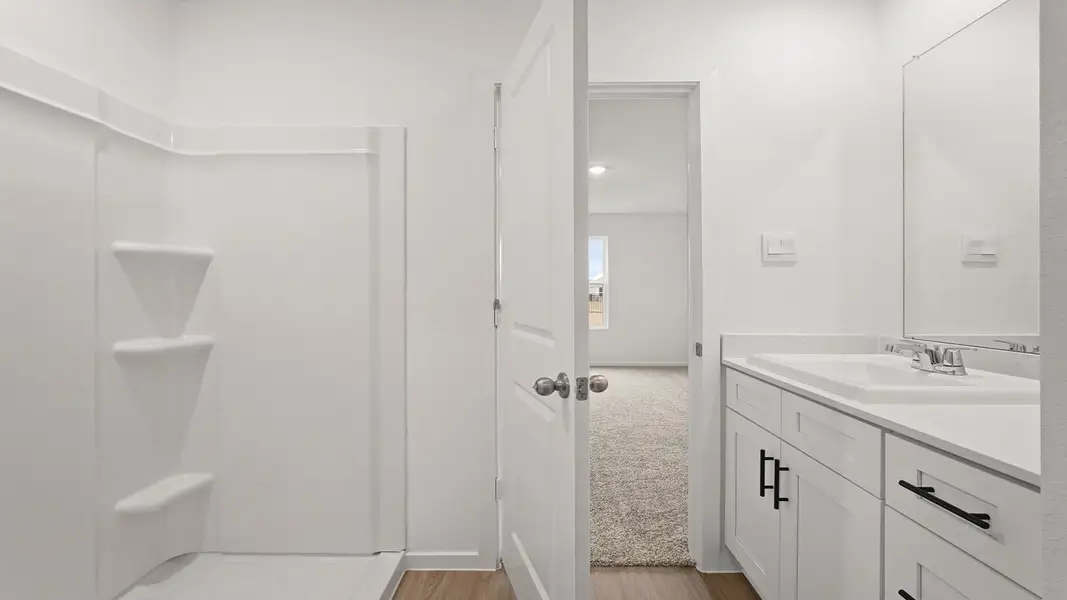 Furnished interior view inside a new home in Sunterra, Katy (Image 8).