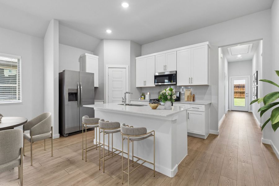 Kitchen in the Cypress home plan by Trophy Signature Homes - REPRESENTATIVE PHOTO