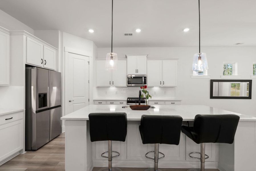 Furnished interior view inside a new home in Summerwind Crossing at Lakes of Cane Bay, Summerville (Image 8).