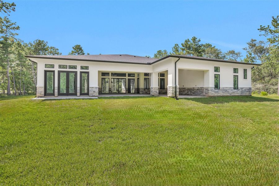 Large frameless glass double doors to the Primary Bedroom and L-shaped Covered Patio offers amazing indoor/outdoor living and yard access. 2 ethernet/data connections for power over ethernet (POE) security cameras on each side of the home.
