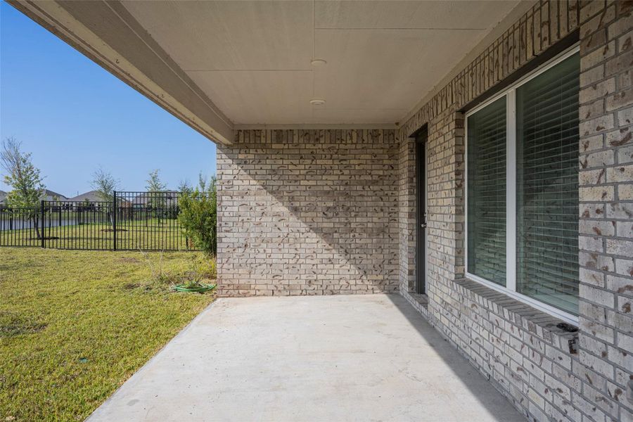Exterior details and patio area of a home in Sunterra, Katy (Image 3).