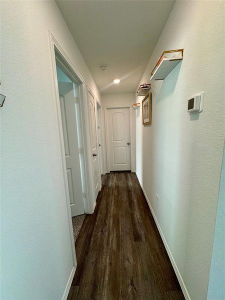 Hallway offers built in coat closet and linen storage