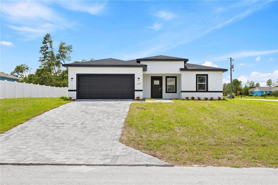 Front exterior of a new home in , Ocala, FL, highlighting curb appeal (Image 2). Front exterior of a new home in , Ocala, FL, highlighting curb appeal (Image 2).