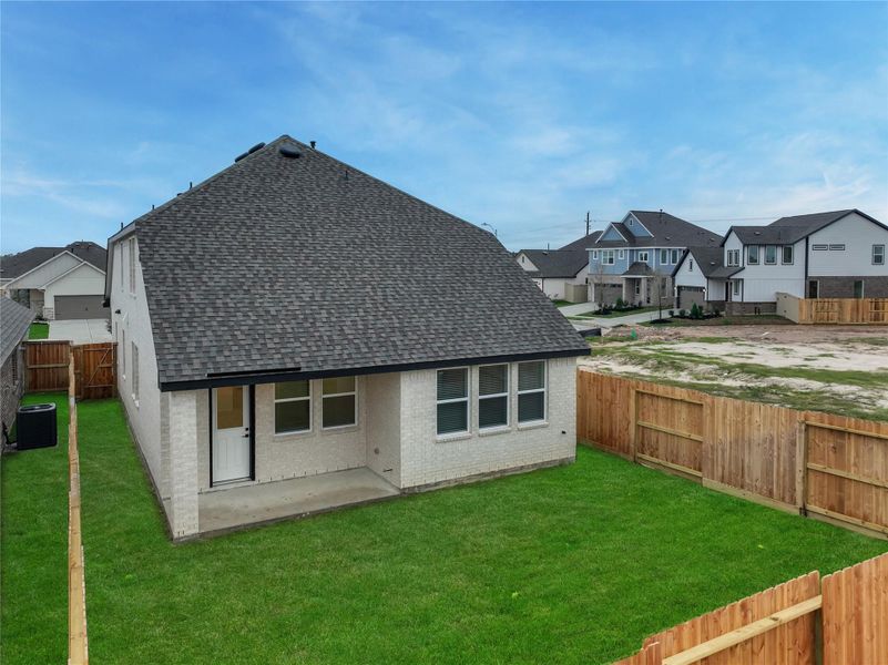 Exterior details and patio area of a home in Oakberry Trails, Waller (Image 26).