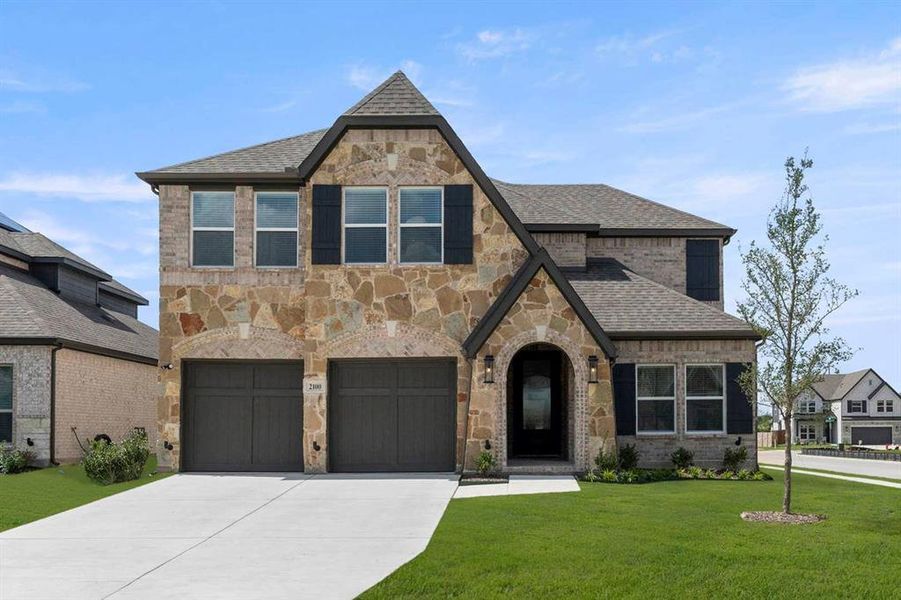 Front exterior of a new home in Valencia on The Lake, Little Elm, TX, highlighting curb appeal (Image 26). Front exterior of a new home in Valencia on The Lake, Little Elm, TX, highlighting curb appeal (Image 26).