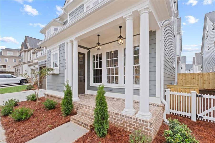 Front exterior of a new home in , Woodstock, GA, highlighting curb appeal (Image 24).