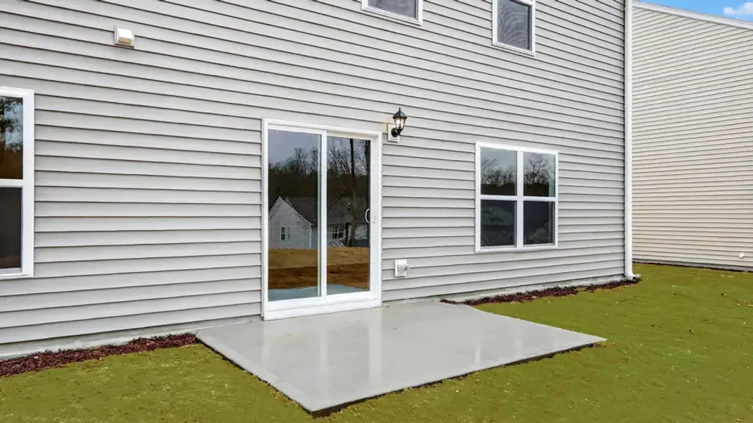 Exterior details and patio area of a home in Mangum Farms, Stem (Image 3).