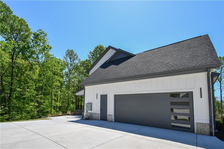 Front exterior of a new home in , Hoschton, GA, highlighting curb appeal (Image 25).