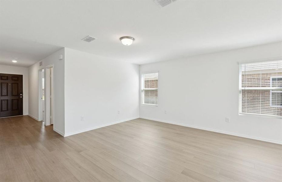 Dining nook off kitchen with large windows Dining nook off kitchen with large windows