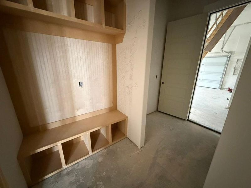 Mudroom with concrete flooring Mudroom with concrete flooring
