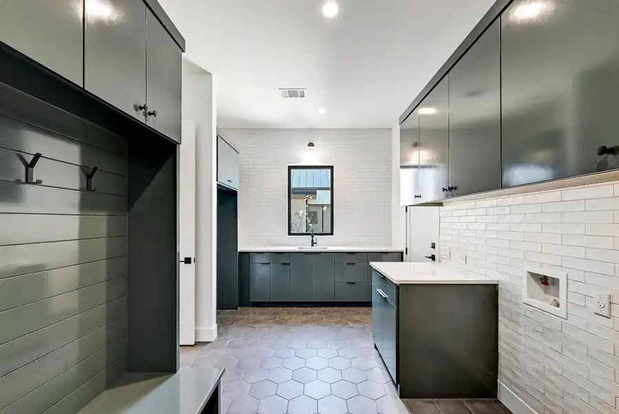 Laundry/mudroom with tons of storage. Room for additional fridge. Laundry/mudroom with tons of storage. Room for additional fridge.