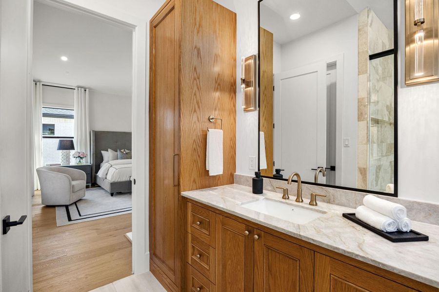 Incredible Primary Bathroom features over-sized walk-in glass encased shower w/ 2 sets of fixtures & soak tub, Custom Site built cabinetry & natural stone wall tile. Incredible Primary Bathroom features over-sized walk-in glass encased shower w/ 2 sets of fixtures & soak tub, Custom Site built cabinetry & natural stone wall tile.