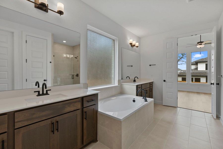 Primary Bath retreat with dual vanities & garden tub