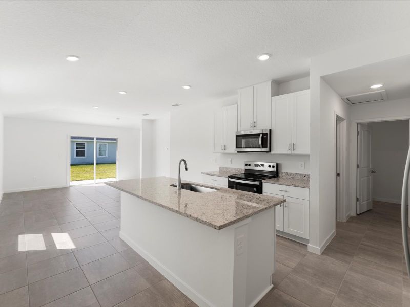 Furnished interior view inside a new home in Flagler Village - Classic Series, Palm Coast (Image 5). Furnished interior view inside a new home in Flagler Village - Classic Series, Palm Coast (Image 5).