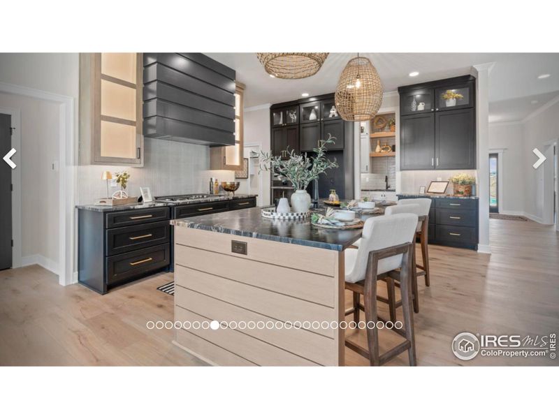 Kitchen w/large island.  Actual photo of previous build by sister company in another state.