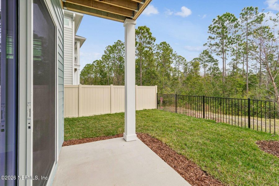 Exterior details and patio area of a home in Kettering at eTown - Paired Villas, Jacksonville (Image 19).