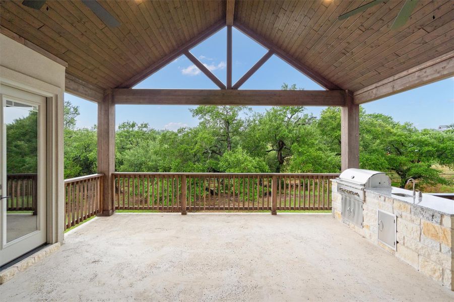 Covered Outdoor Living Area Overlooking Massive Oak Tree Covered Outdoor Living Area Overlooking Massive Oak Tree