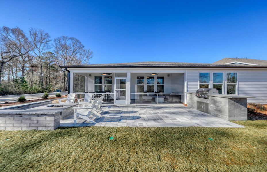 Entertain on the inviting outdoor patio, complemented by a covered porch.