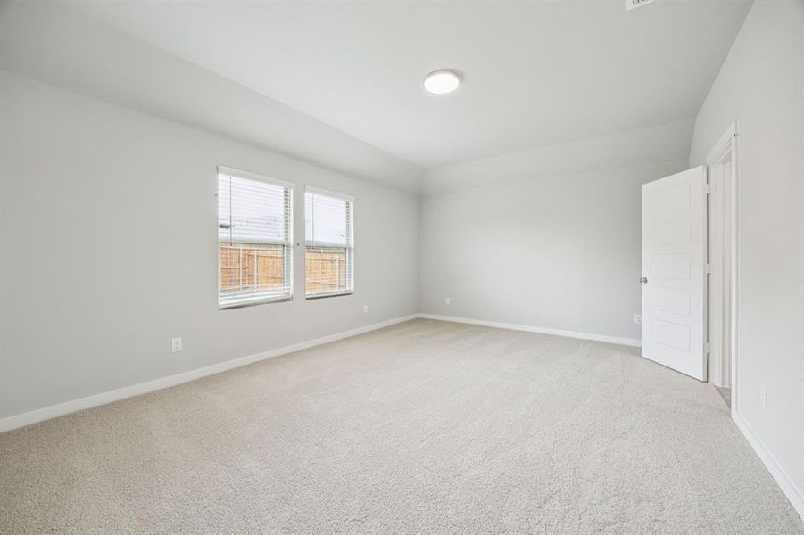 Primary Suite in the Hayden home plan by Trophy Signature Homes – REPRESENTATIVE PHOTO