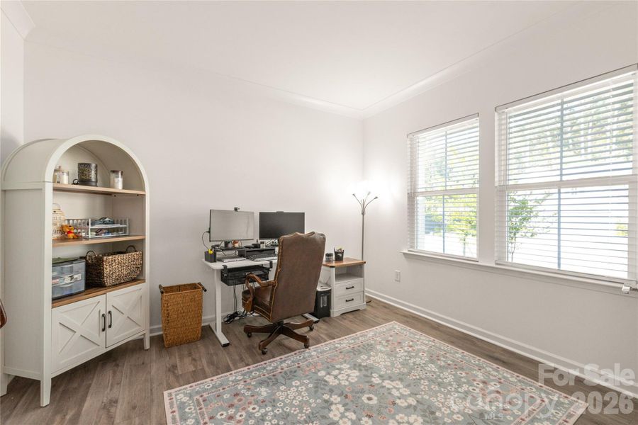 The sunny flex room at the front of the home is currently used as an office, but has many options.