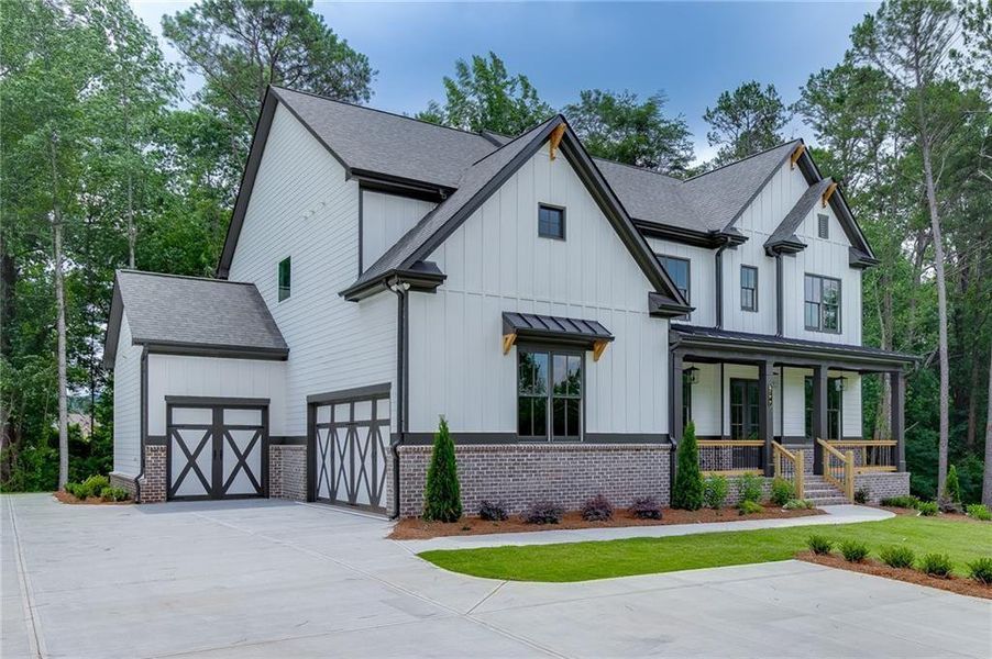 Front exterior of a new home in , Cumming, GA, highlighting curb appeal (Image 29). Front exterior of a new home in , Cumming, GA, highlighting curb appeal (Image 29).